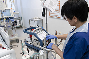 Vicky Scollen, staff nurse on the adult intensive care unit, using the ECMO equipment