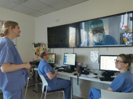 Clinicians using webcam to access virtual support from consultants