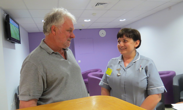 Healthcare assistant Anna Krawczyk and a patient in the Squire Centre waiting area