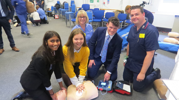 Wayne Hurst (matron in cardiothoracic surgery) and Sarah Chorbachi (practive facilitator in cardiology) showing Kajal, Melissa and Monty from Rickmansworth School some CPR essentials 