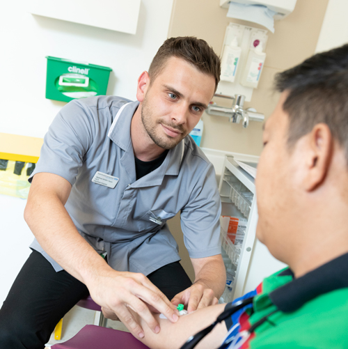 Male nurse taking blood sample