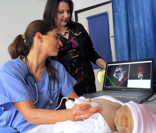 Dr Nitha Naqvi and doctor using simulation doll 