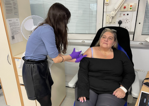 Patient being injected with new drug for asthma by a member of staff