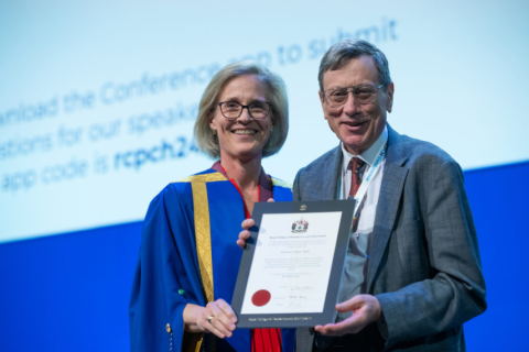 Professor Andy Bush receiving the James Spence Medal from then RCPCH President Dr Camilla Kingdon 